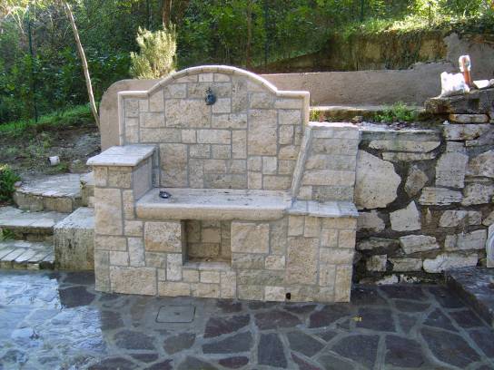 Fountain in draft of travertine